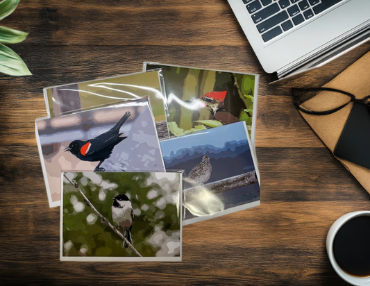 5 art cards in a pile on a desk